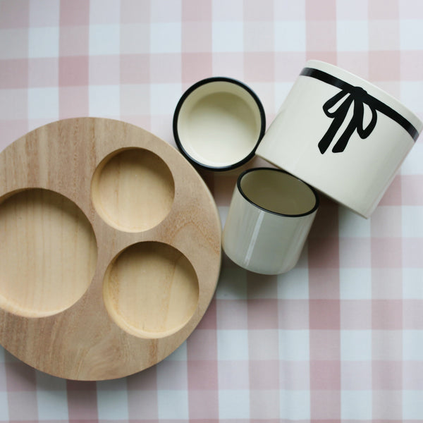 Three Bowls with a Wooden Base