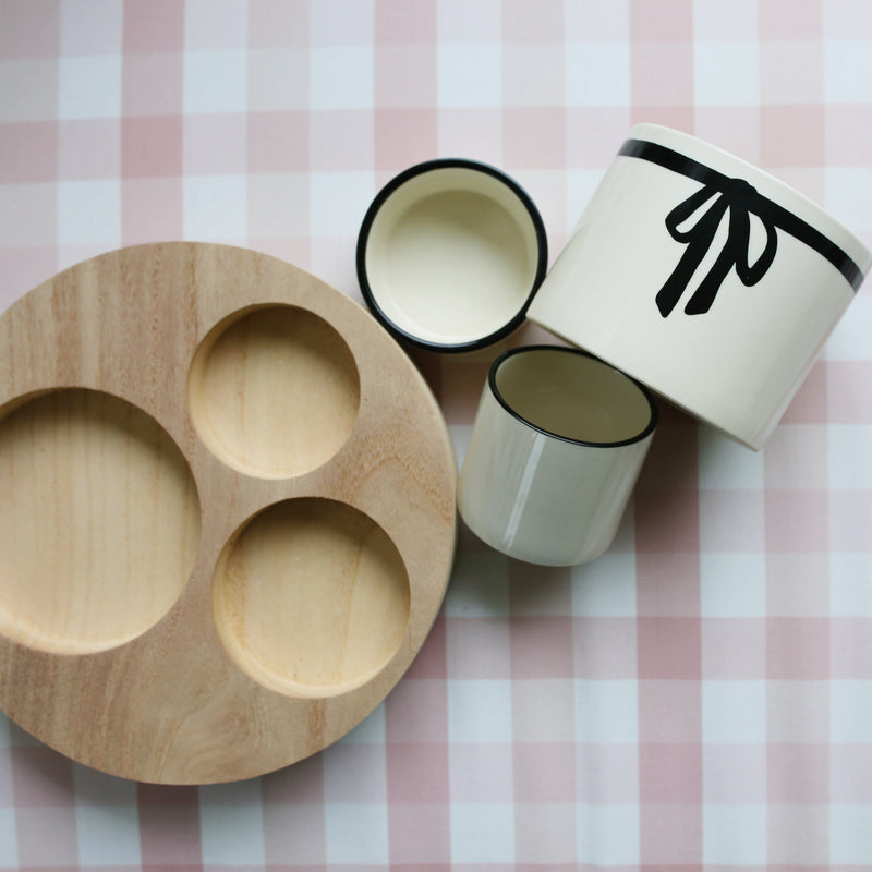 Three Bowls with a Wooden Base